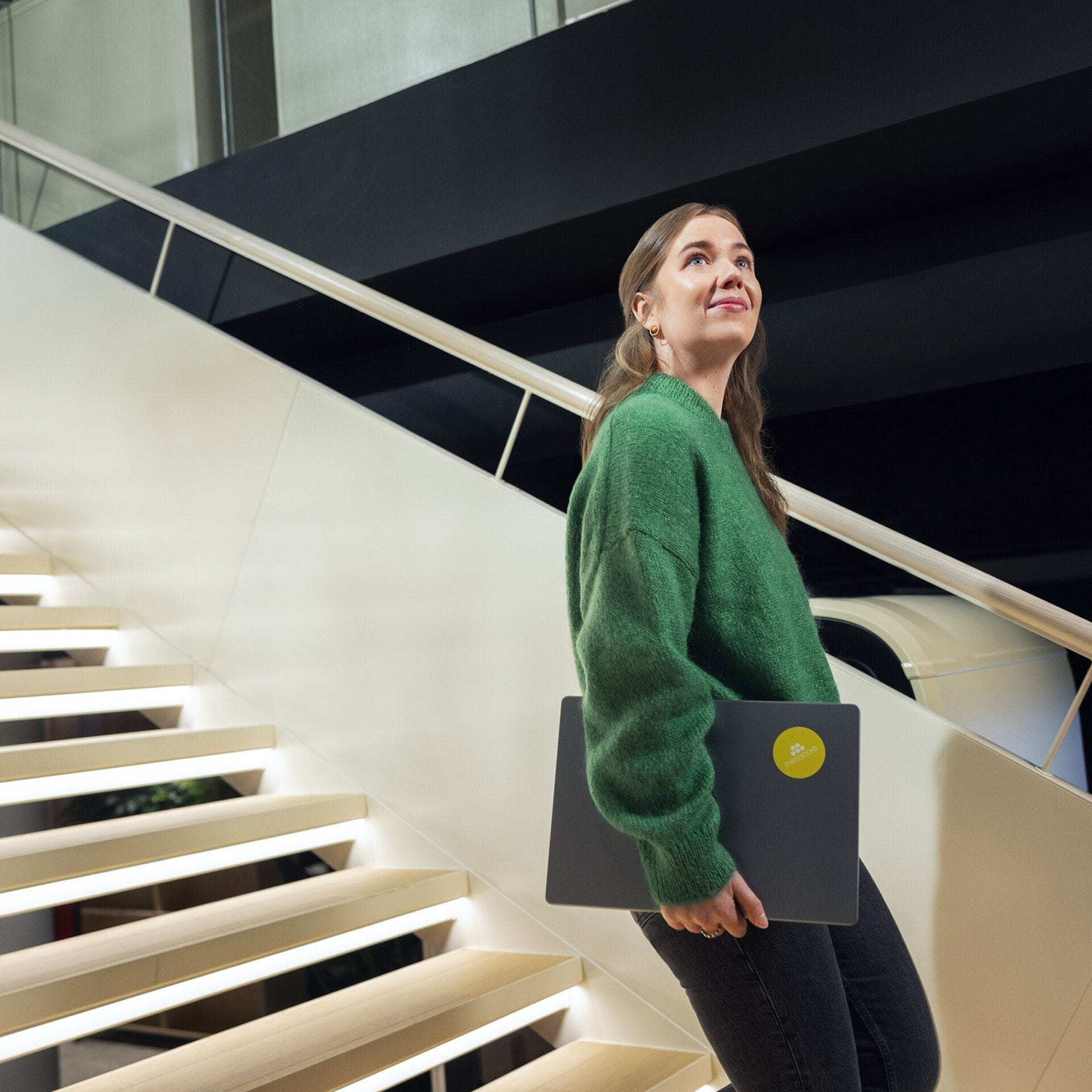 Person walking down stairs at Metacore